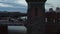 Bikers and Car traffic on Berlin Oberbaum Bridge old famous building over Spree River in evening, Aerial Follow Slide