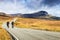 Bikers on a highway through a desolate landscape