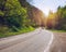 Bikers on mountainous highway, biker on the road in sunset light