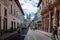 Bikers and pedestrians on a sunday closed street of Quito and Basilica del Voto Nacional - Quito, Ecuador