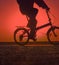 Bikes on beach, sunset sky background