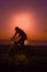 Bikes on beach, sunset sky background