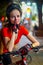 Bikes bicyclist girl wearing bicycle helmet. Outdoor night portrait.