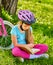 Bikes cycling girl wearing helmet read book rest near bicycle. .