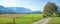 Bikeway through moor landscape Murnauer Moos, with alps view upper bavaria