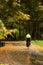 Biking in colorful autumn park during rain