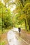 Biking in colorful autumn park during rain