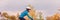 Biking in fall autumn nature Asian cyclist girl riding bicycle doing outdoor sport in cold weather. Panoramic banner