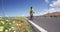 Biking tourist man cycling on road bike traveling in summer doing ecotourism