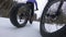 Biking in winter on fat bike. Woman fat biker riding bicycle in the snow in winter. Close up action shot of fat tire