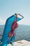 Bikini drying on a deck chair on a pier