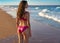 Bikini girl in the beach blue shore