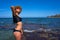 Bikini girl in summer Mediterranean beach having fun