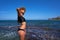 Bikini girl in summer Mediterranean beach having fun