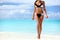 bikini suntan body woman relaxing on beach