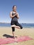 Bikram yoga tadasana pose at beach