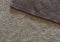 Bilateral beige and brown polar fleece fabric texture close up