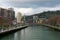 Bilbao, Spain/Europe; 29/12/18: Red modern bridge of La Salve crossing Nervion river in the city of Bilbao, Spain