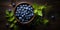 Bilberry banner. Bowl full of bilberries. Close-up food photography background