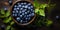 Bilberry banner. Bowl full of bilberries. Close-up food photography background