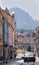 Bilina, Czech republic - May 12, 2018: cars, people, historical houses in Seifertova street and high hill named Boren on Backgroun