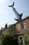 Bill Heine`s Shark in a roof statue in Headington, Oxford in the UK