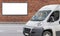 Billboard banner and white commercial transportation and delivery van