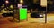 Billboard with a chroma key green screen on a traffic cars city night street, light night, advertisement