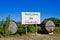 Billboard that says Welcome to the Chianti with barrels