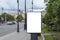 Billboard vertical, white isolate. on the background of the city and
