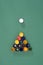 Billiard ball with colorful paints on green billiard table