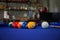 Billiard balls composition on blue pool table