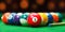 Billiard balls in a green pool table