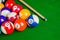 Billiard balls on green table with billiard cue, Snooker,