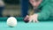 Billiard balls roll on the green table. Slow