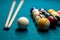 Billiard cue and colour balls on snooker table while game