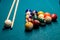 Billiard cue and colour balls on snooker table while game