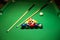 Billiard cues and pyramid of multicolored pool balls