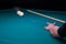 Billiard green table in hall with white balls