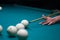 Billiard green table in hall with white balls