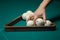 Billiard green table in hall with white balls