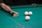 Billiard green table in hall with white balls