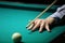 Billiard. hand with cue prepare hit a ball