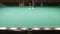 Billiard player makes a beautiful shot and scores the ball in the pocket