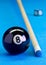 Billiard pool game eight ball with chalk and cue on billiard tab