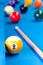 Billiard pool game nine ball with cue on billiard table