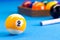 Billiard pool game nine ball with cue on billiard table