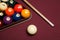 Billiard pool table with cue stick triangle and balls