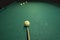 Billiard table with balls and cue