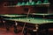 Billiard table with green surface and balls in the billiard club.Pool Game